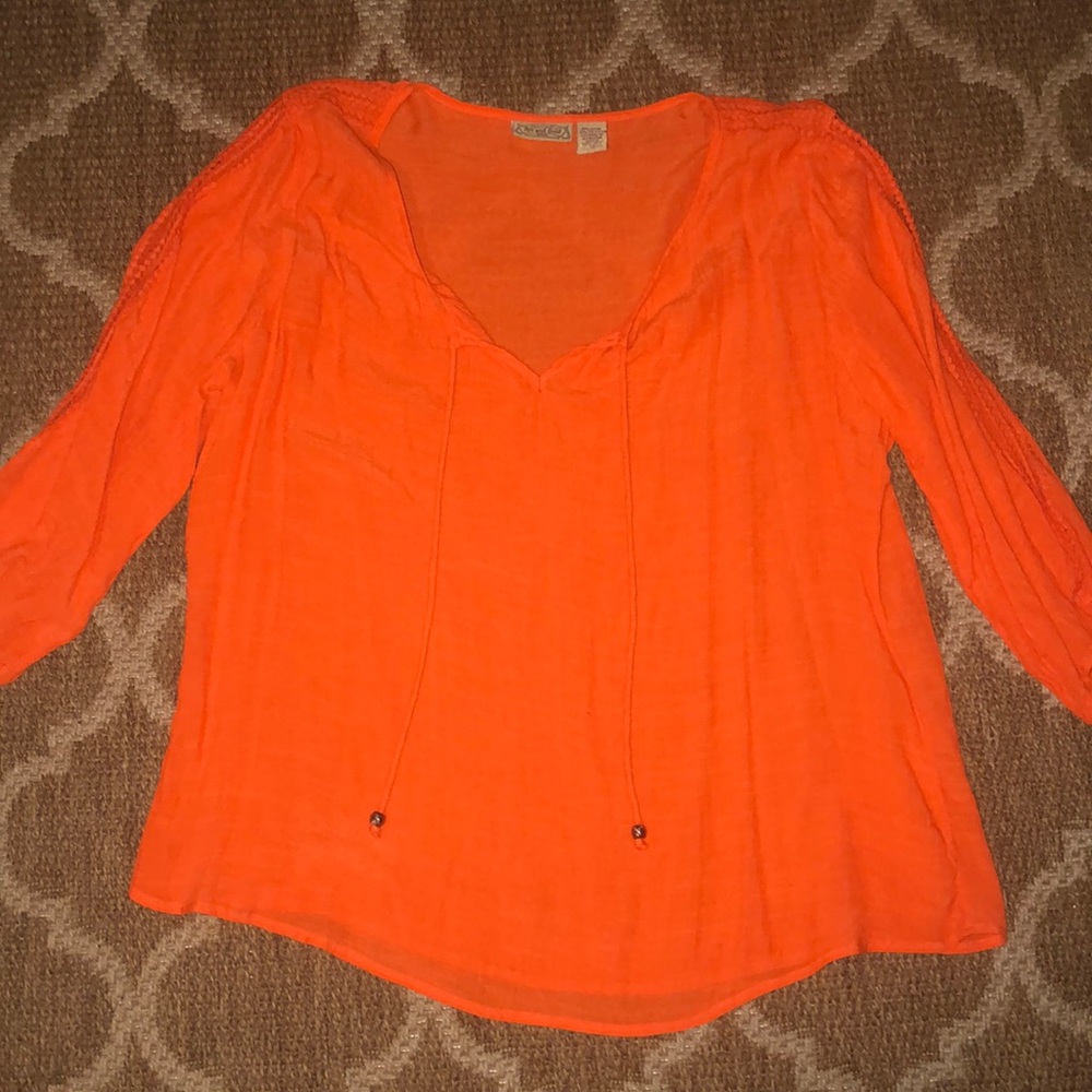 Thin bright orange blouse